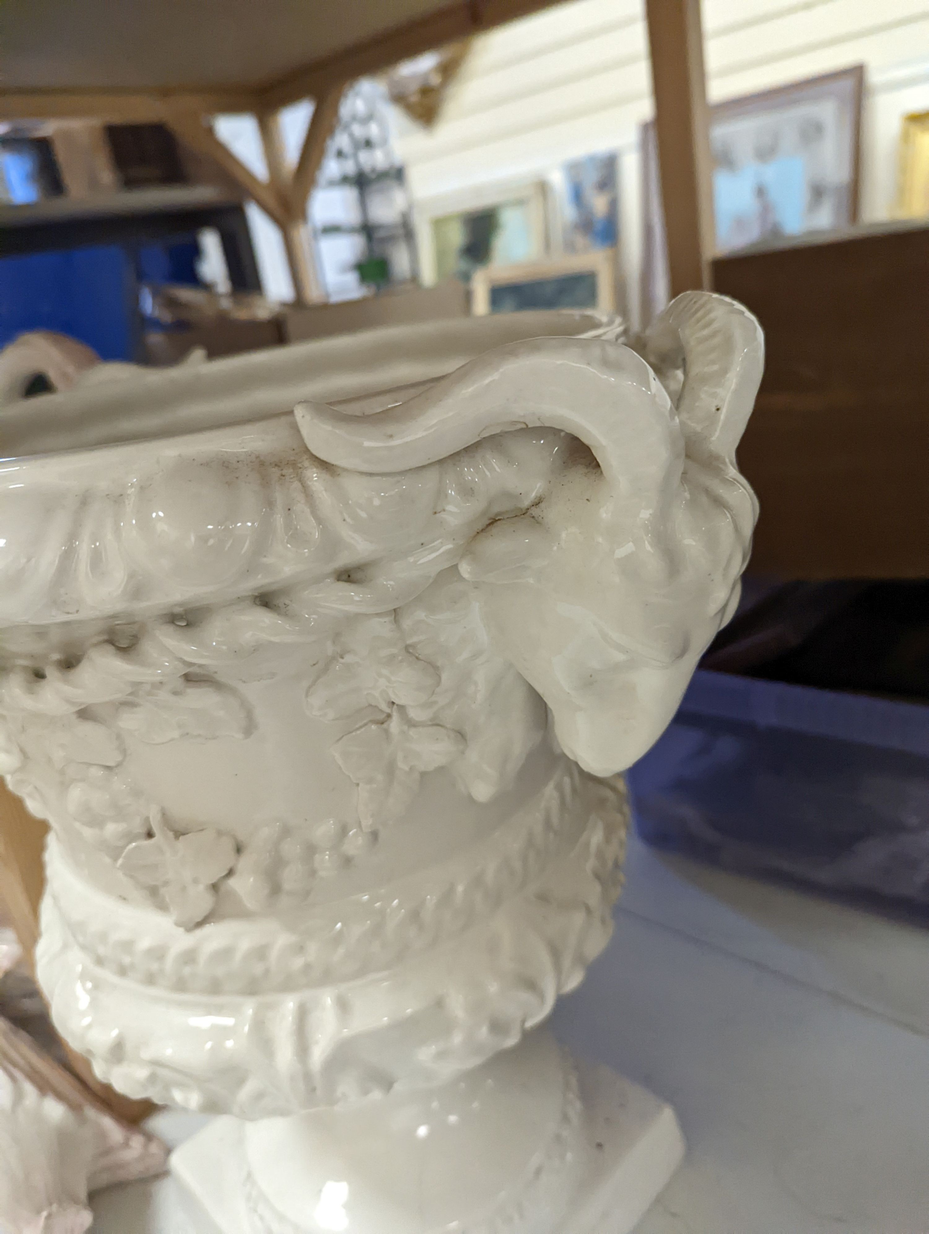 Decorative modern continental pottery, including two jardinières, modelled with swans, a white glazed urn
